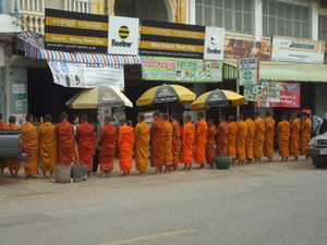 Monks receiving alms - Battambang