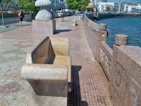 Stone benches by the water in Muscat
