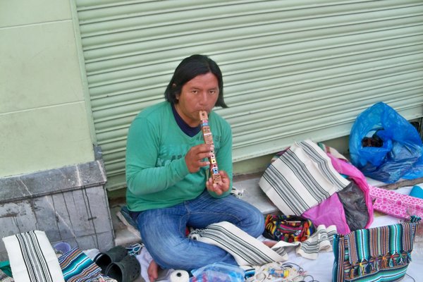 Indian Lady Selling Flutes