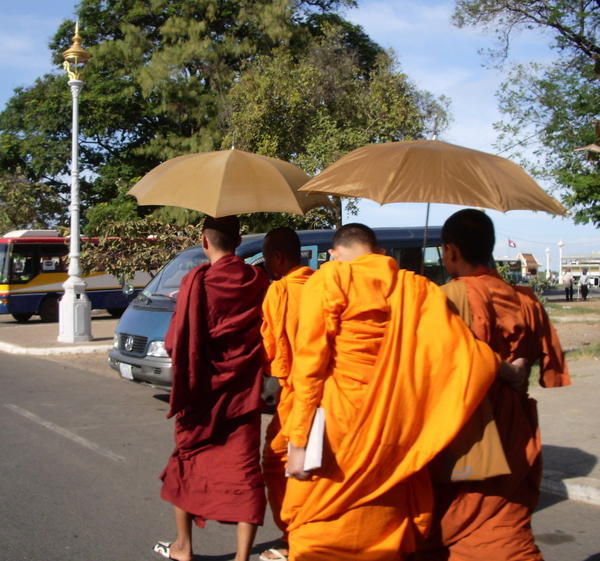 Monks with umbrellas