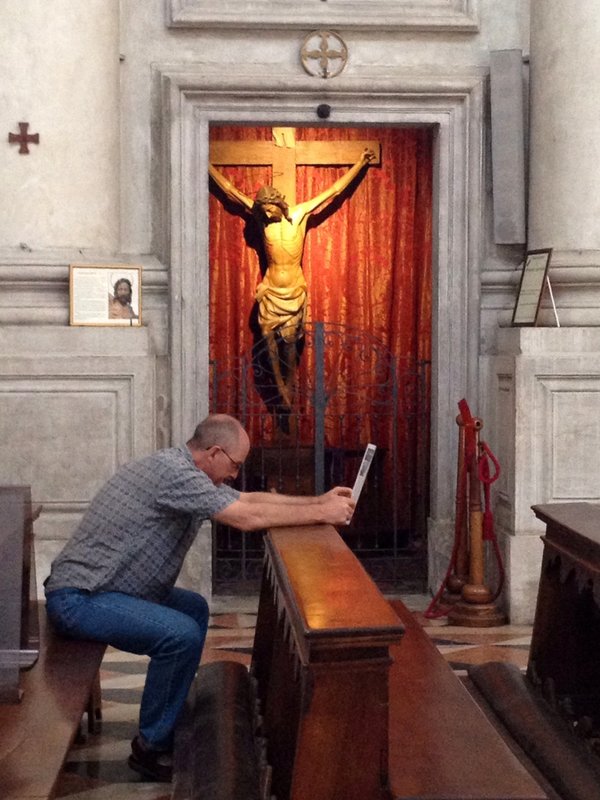 Dad happens to prostrate himself in front of Christ while reading the info pamphlet