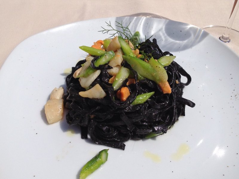 Squid ink tagliatelle with scallops and scallops