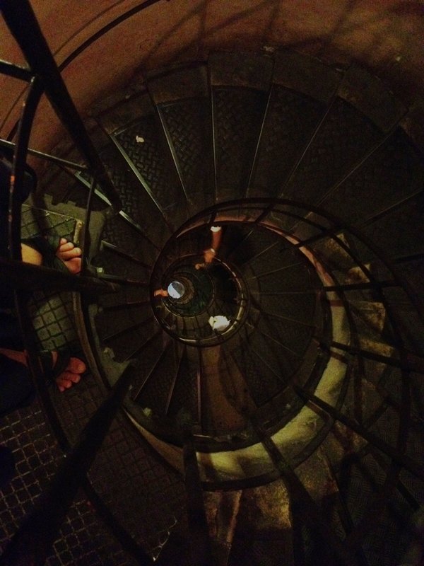 Very cool spiral staircase in the Arc de Triomphe  where you can see light at the bottom of the 284 stairs