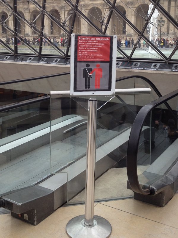 While you're distracted by one of 38 pickpocket  warnings, they pick your pocket - Louvre