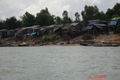 Houses Along The Banks Of The Mekong