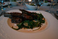 Marinated Lamb Cutlets, Wilted Rocket, and Cumin Infused Jus