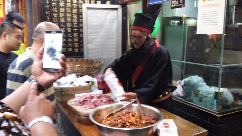 Zhang Fei selling meat