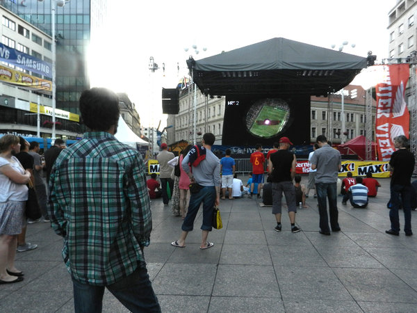 Square with giant soccer game screen