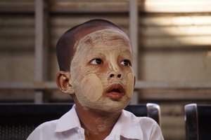 Thanaka powder smeared face