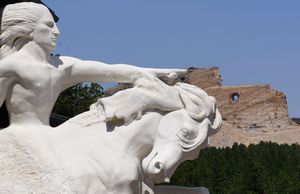 Crazy Horse model against monument