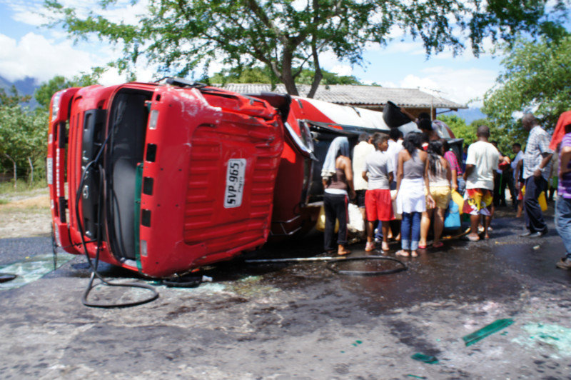 Locals plundering a crashed petrol truck