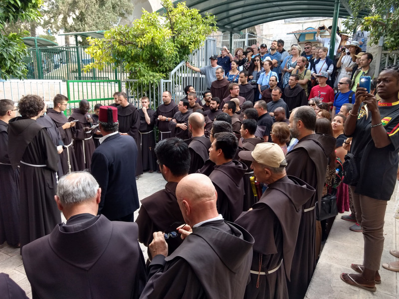 Franciscan monks prepare to start the Stations of the Cross. on the Via Dolorosa.