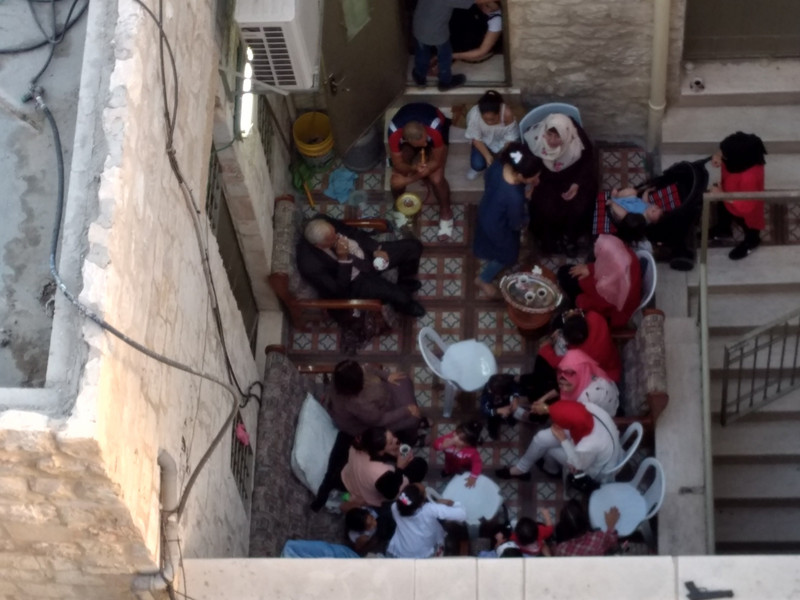 Arab family socializing at home in Jersusalem's Old City.