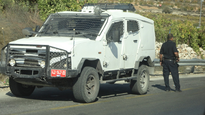 Patrol car near an intersection outside Hebron.