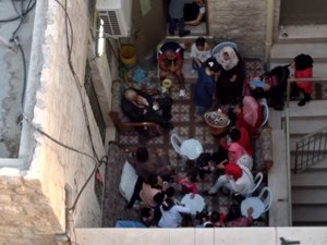Arab family socializing at home in Jersusalem's Old City.