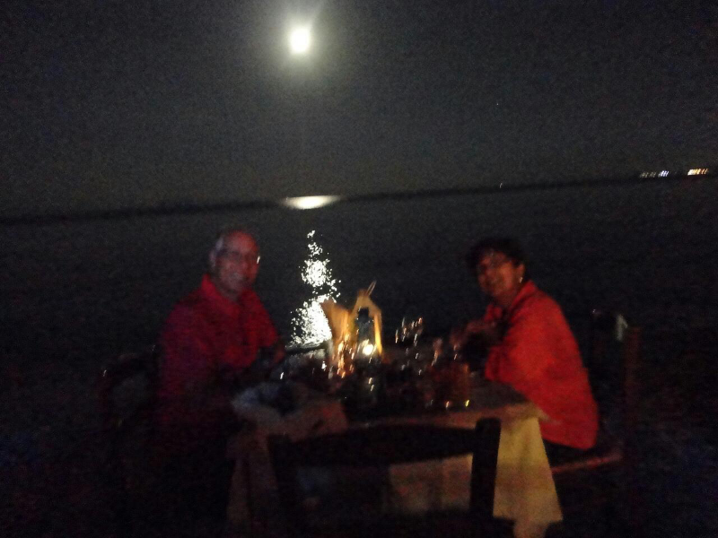 Dinner at Isidora's under a moonlit sky.
