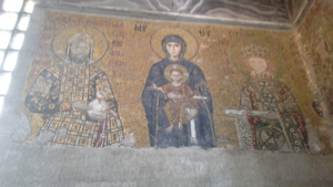 Icons of Jesus sitting on Mary while Emperor and Empress offer money to the church.