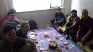 Sitting for a traditional dinner with a Turkish family.