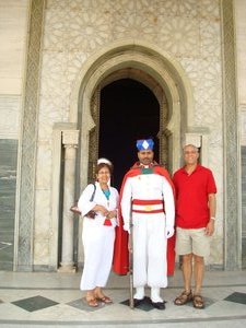 Standing with the guard outside the Hassan 11 Mosque in Casablanca.