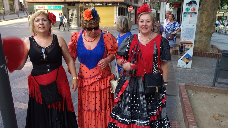 Granada ladies on their way to entertain on stage NB nearby