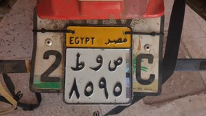 Fitting our  Egyptian numberplates in Abu Simbel