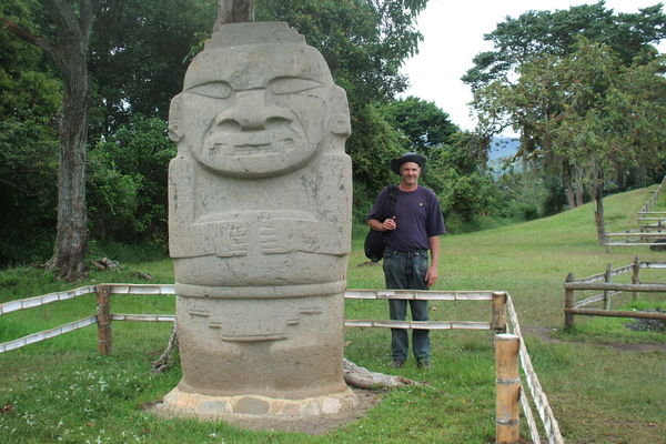 Paul beside a grumpy looking statue
