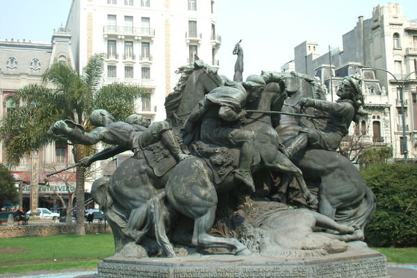 A really gruesome statue of horses and people getting killed