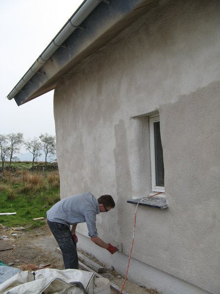 Darragh painting the bottom of the wall