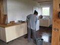 Wendy mopping kitchen floor