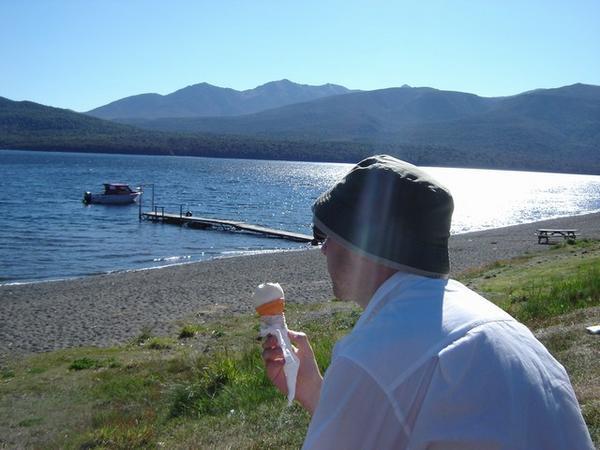 Dave eating ice-cream by the lake, Te Anau