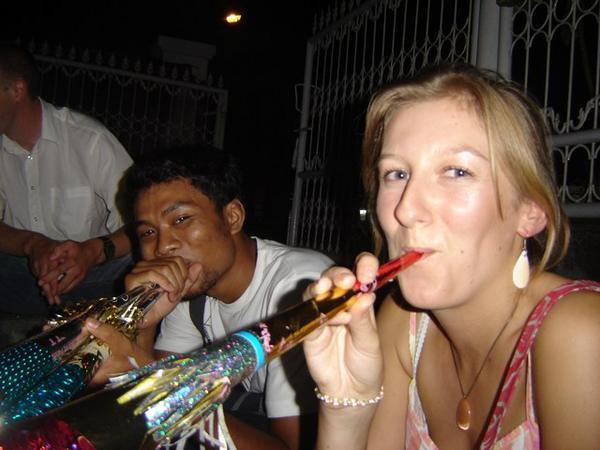 Clare and Adit on NYE with trumpet at hand!
