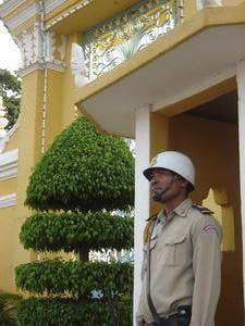 Guard outside the Royal Palace in Phnom Penh, Cambodia