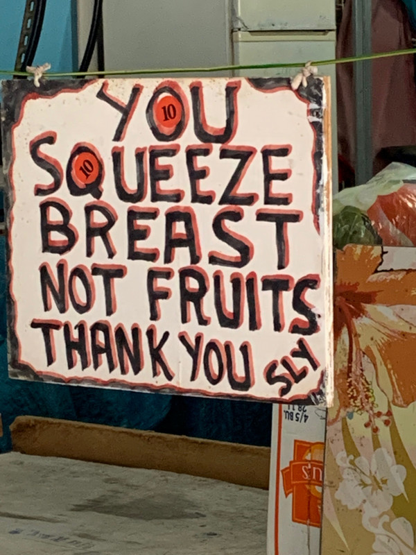 A sign at a fruit and veg stall