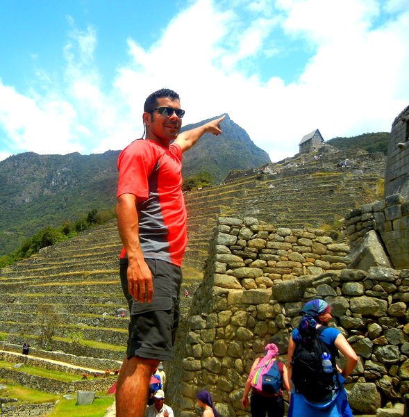 Victor Touching the Top of the Machu Picchu Mountain we just climbed