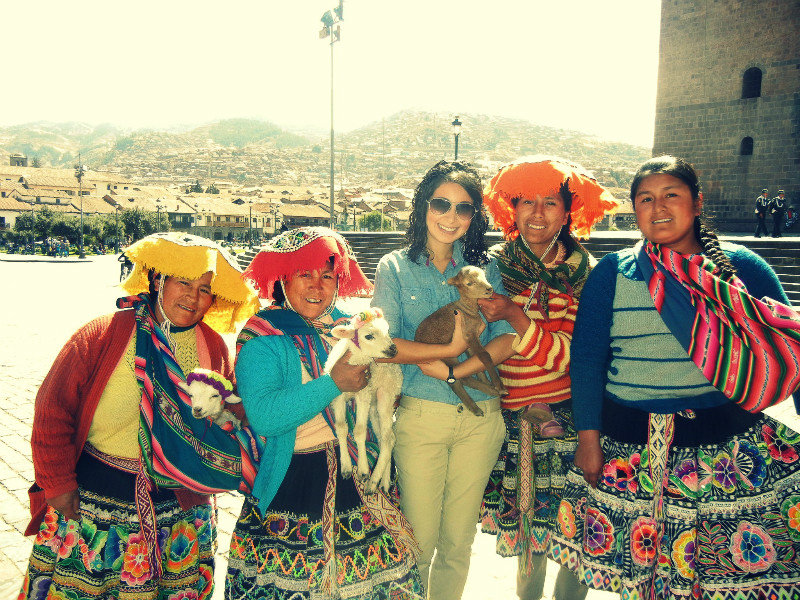 Touristy Picture with Peruvian women and baby goats.
