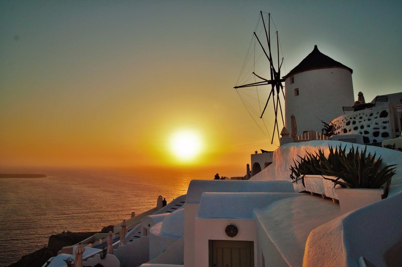 The Oia Windmill glowing in the golden hour.