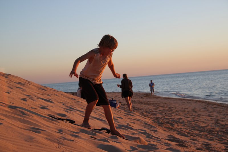 Sand boarding at sunset