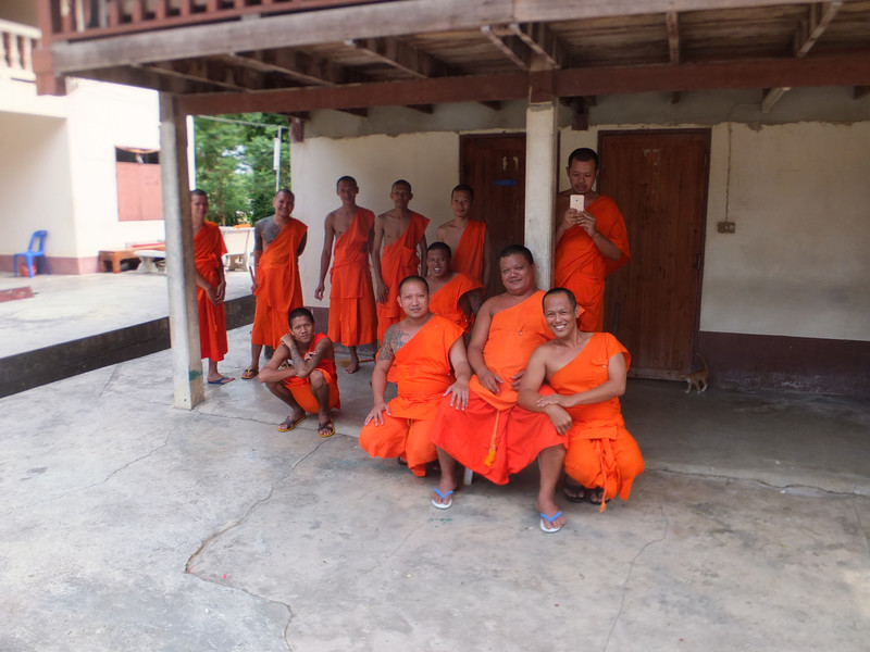 The seniors  (boss monk sitting, gay monk on his left hand side, with big smile)