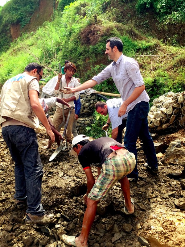 Andrea, pitching in to help clear up road debris on our way to Nuwakot