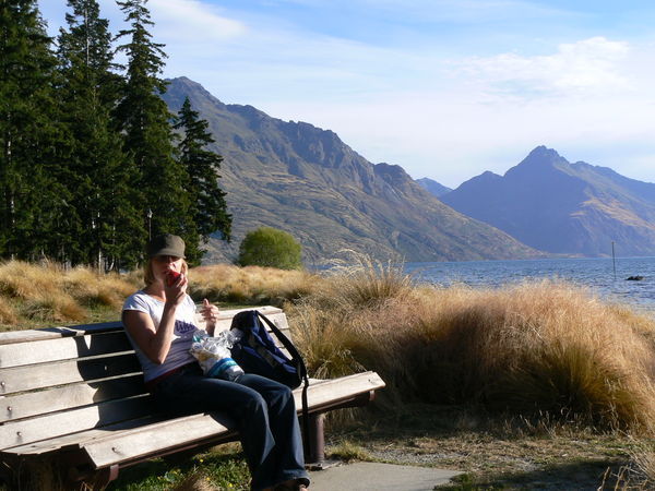 'er indoors enjoying an apple by the lake shore, Queenstown
