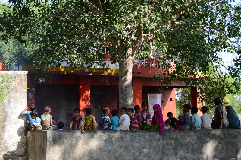 Kids wait for free lunch at the mandir