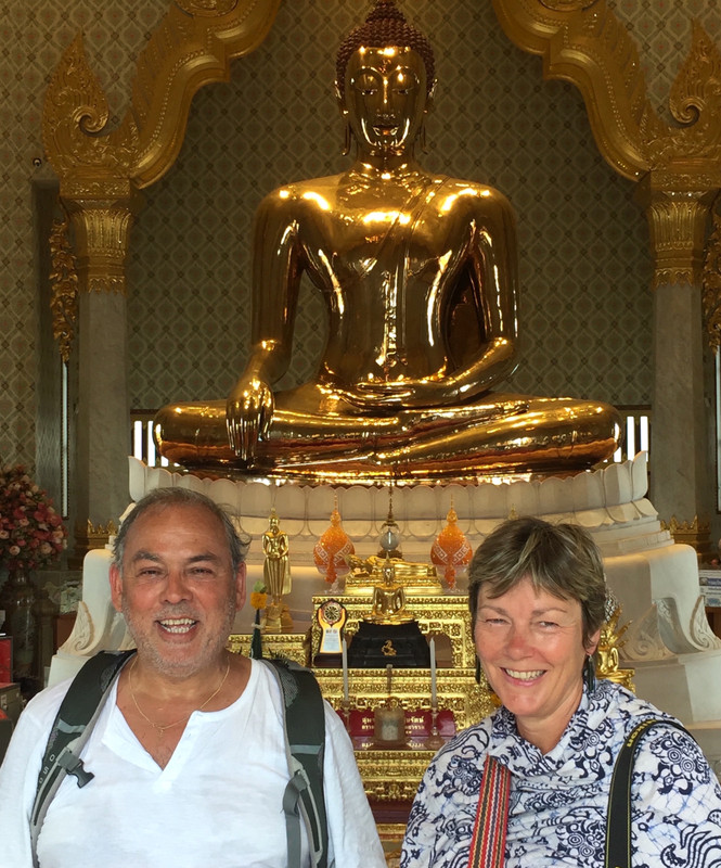 At the staute of the Golden Buddha Temple
