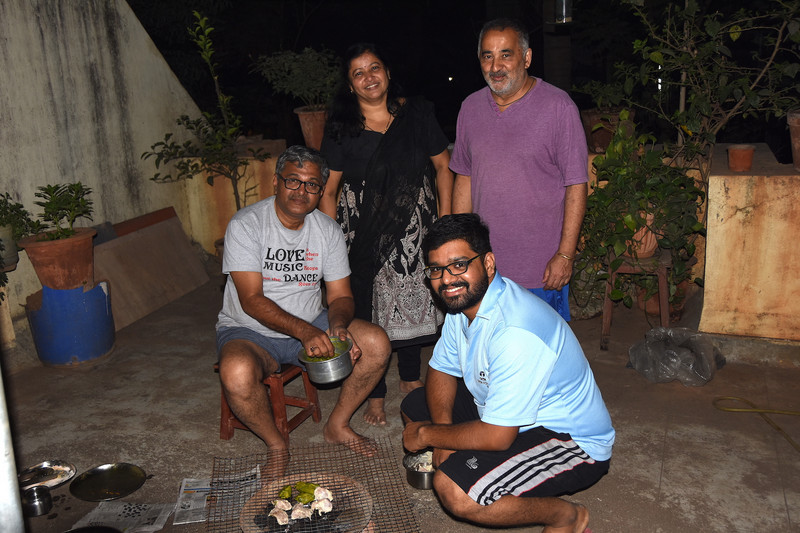 Our congenial hosts treating us to a rooftop seafood  BBQ - Indian style, Mumbai