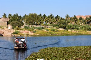 River crossing in a precarious little boat to Anegundi , Hampi, Karnataka