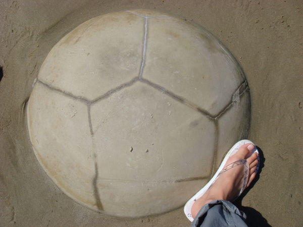 playing footie with a giant boulder!