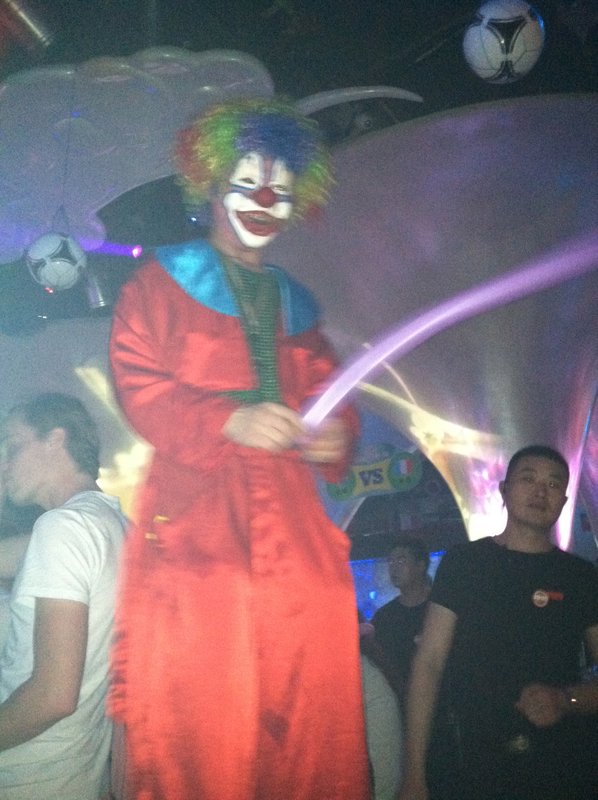 A clown on stilts for night life entertainment? 