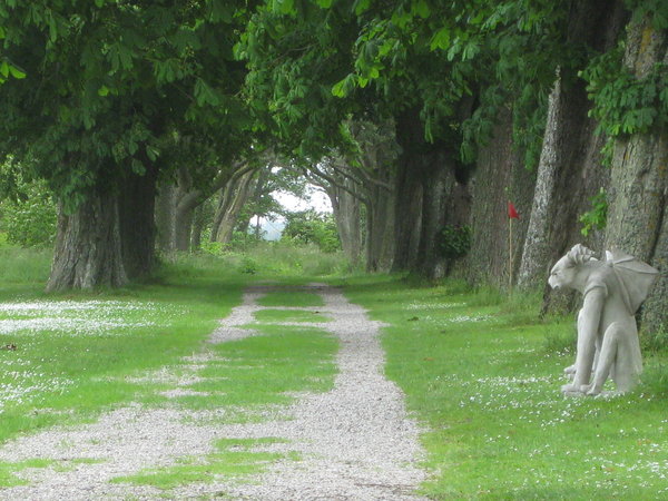 Avenue of trees with gargoyles