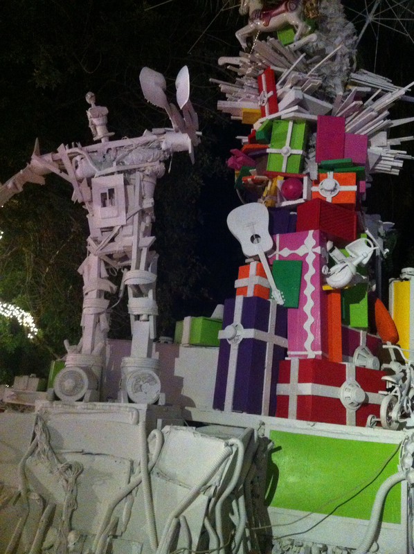 Robot standing guard over a pile of Christmas presents