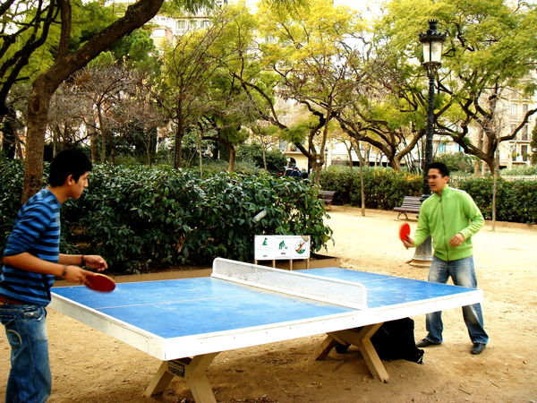 Playing Ping-Pong across the street from Sagrada Familia