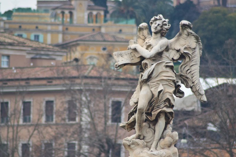Angel on Sant Angelo with Rome in the back